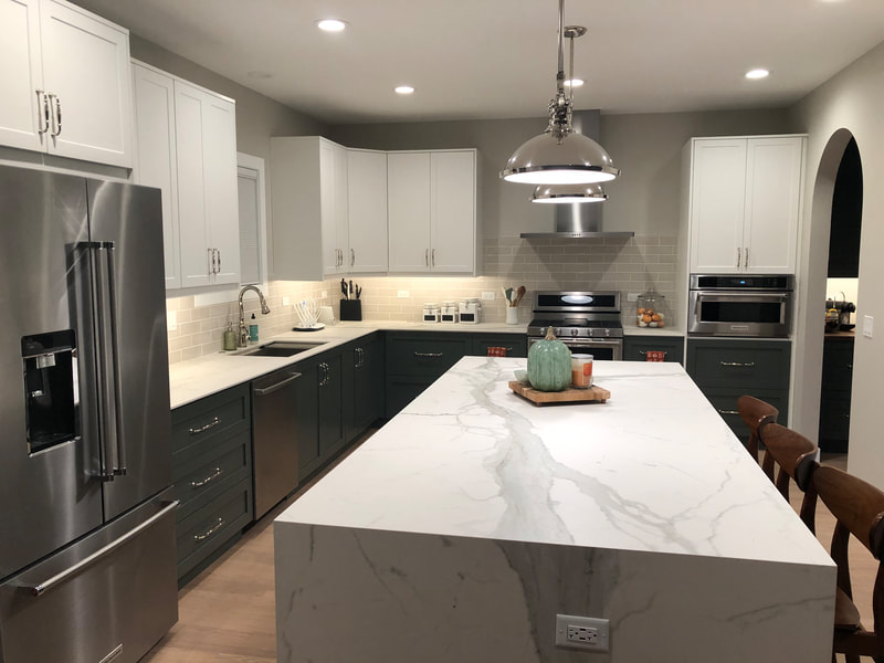 Beautiful waterfall white and gray countertop with IKEA cabinets for our project located in River North in Chicago 